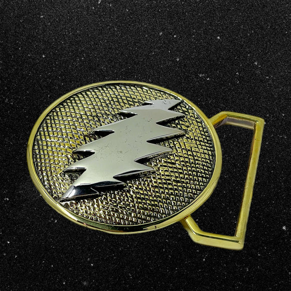 Gold and silver belt buckle on a black background